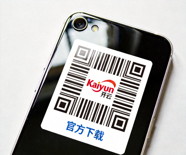 一部手机正在扫描印有Kaiyun开云Logo和下载提示的官方二维码图案